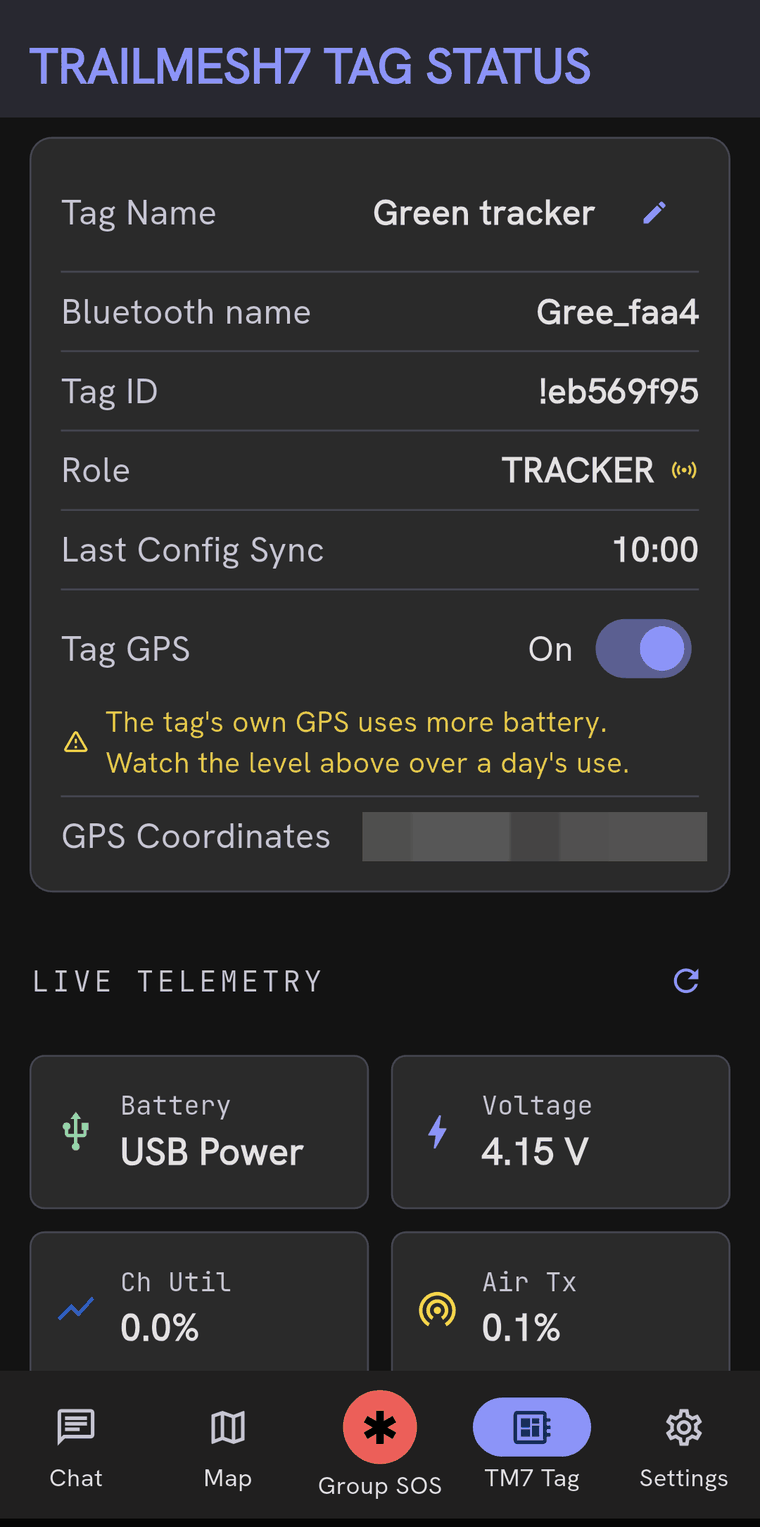 The TrailMesh7 Tag Status screen for a tag named Green tracker, showing its Bluetooth name, tag ID, role TRACKER, tag GPS switched on with a warning that the tag's own GPS uses more battery, an obscured coordinate line, and live telemetry for battery, voltage, channel utilisation and air transmit time.